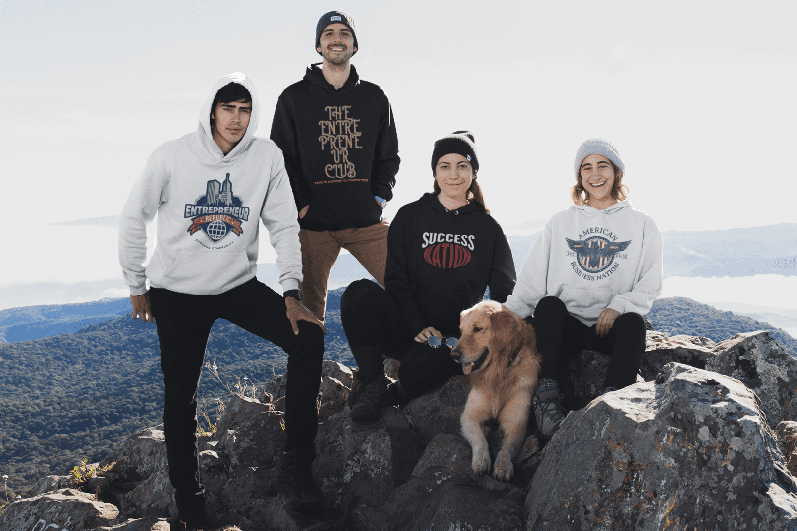 A group of people standing on top of a mountain.