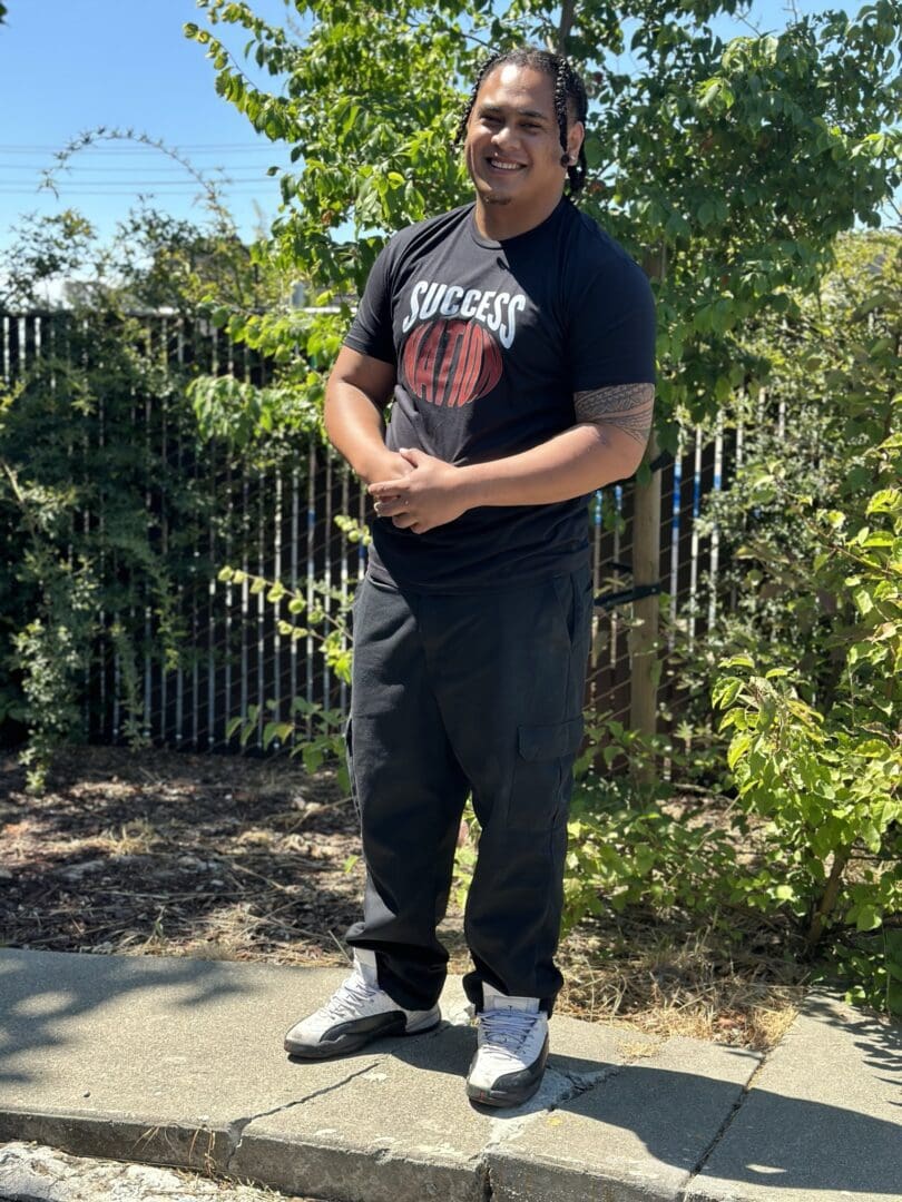 A man standing on top of a skateboard.