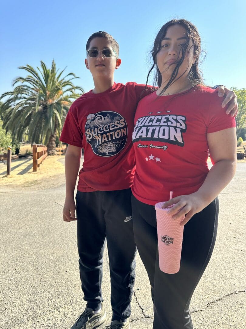 A man and woman standing next to each other.